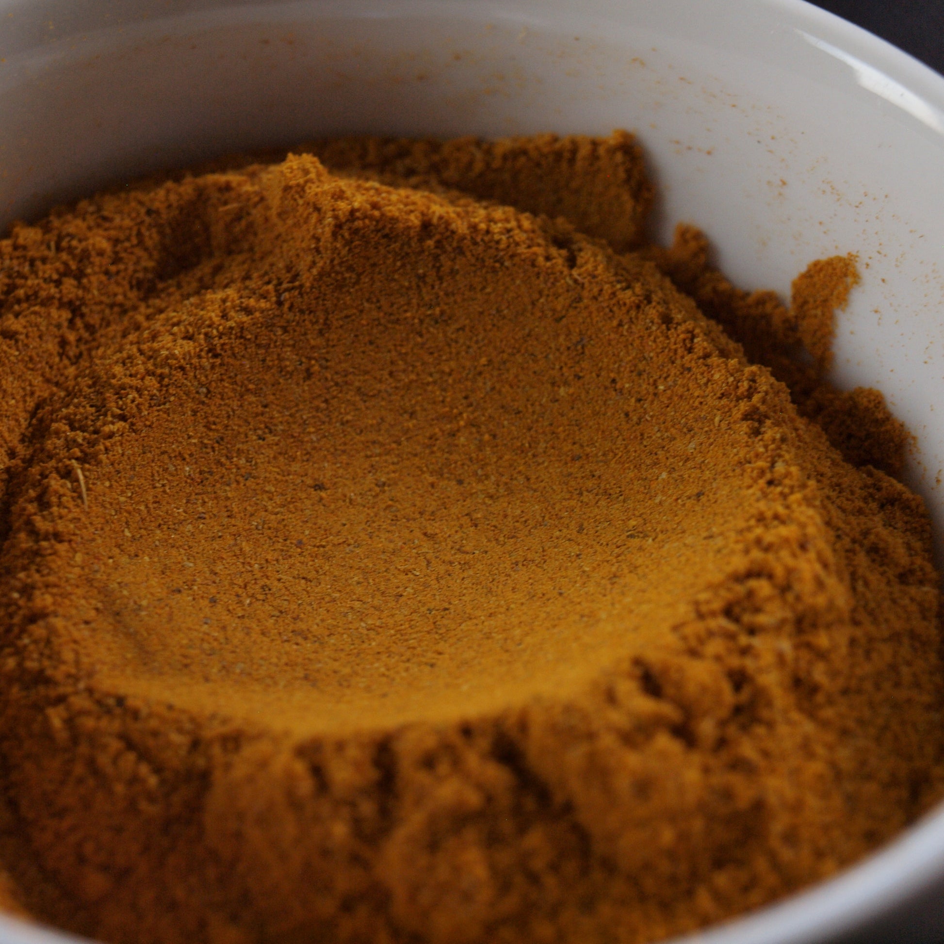 powdered tea, tisane tea, herbal tea, close up image of powdered tea in a white dish