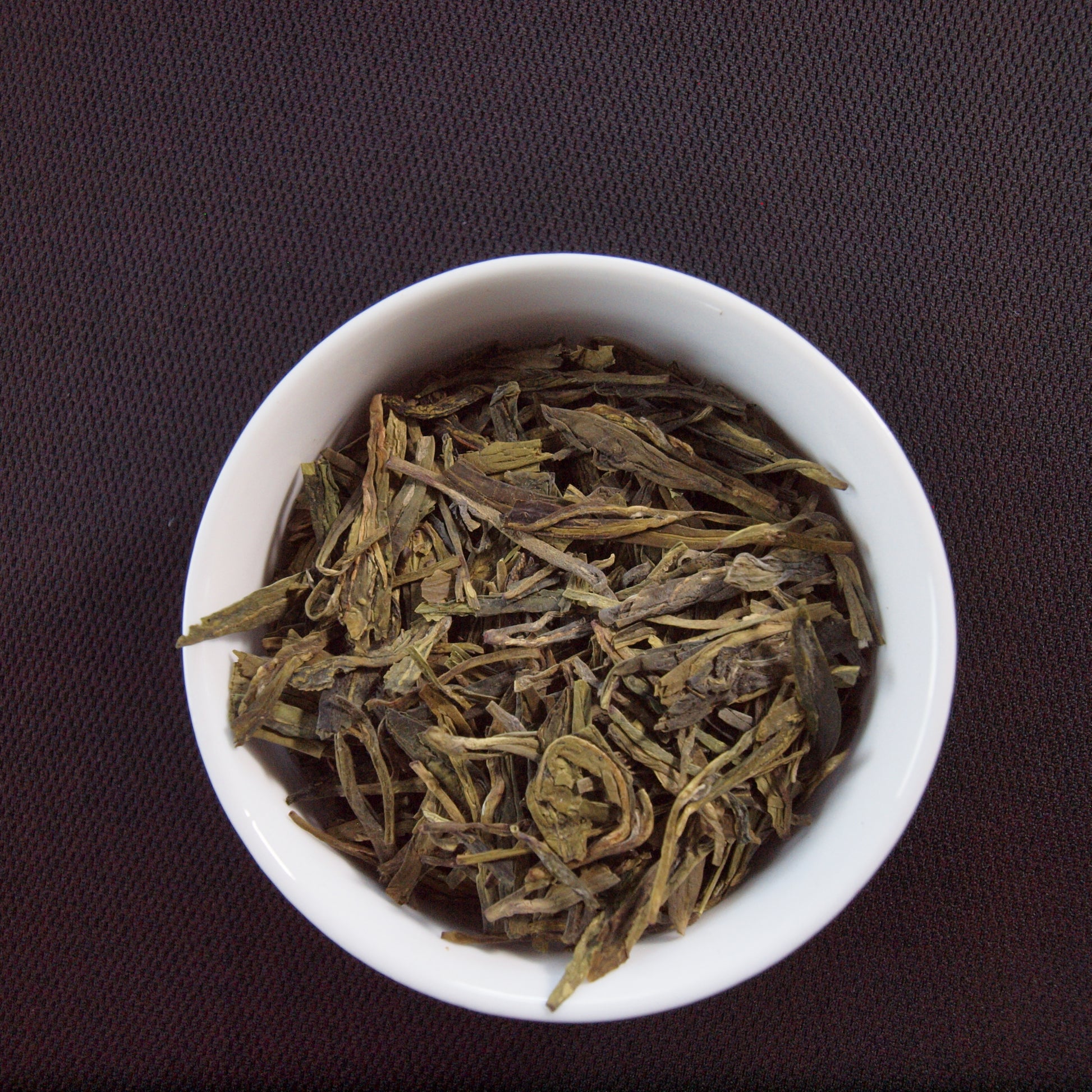 dragonwell tea in dish, green tea