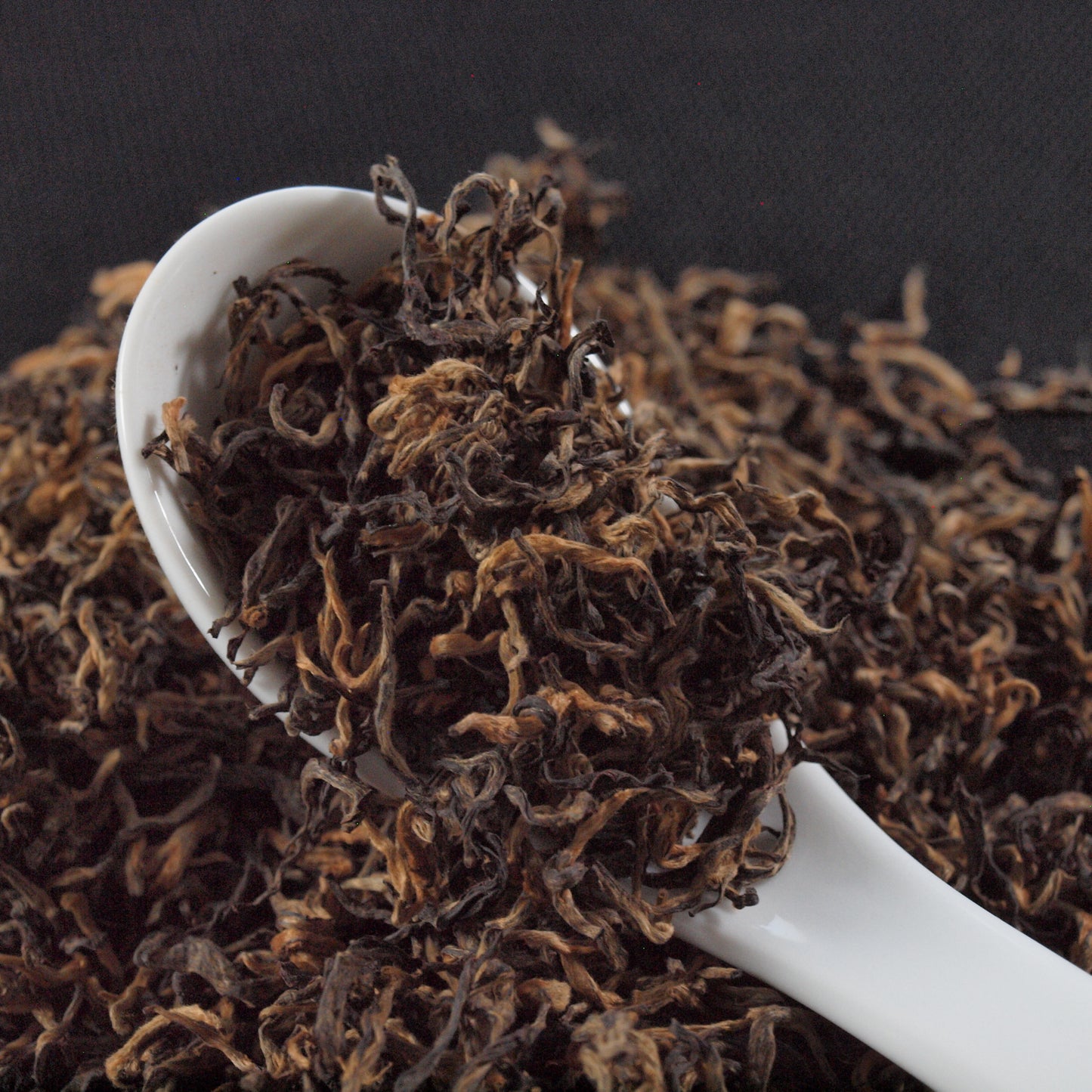 black tea, loose leaf tea, specialty tea, close up of tea in spoon