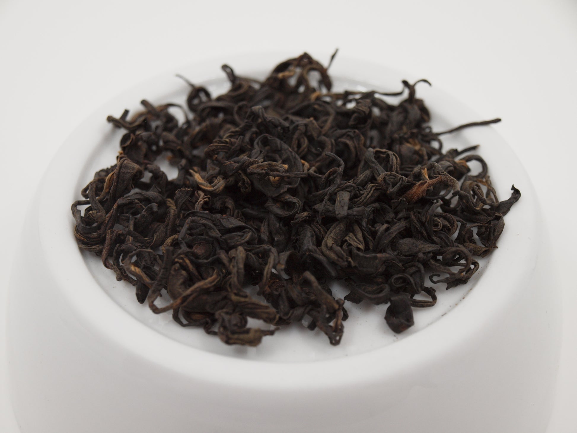 Nepali Oolong tea resting on a dish, close up perspective